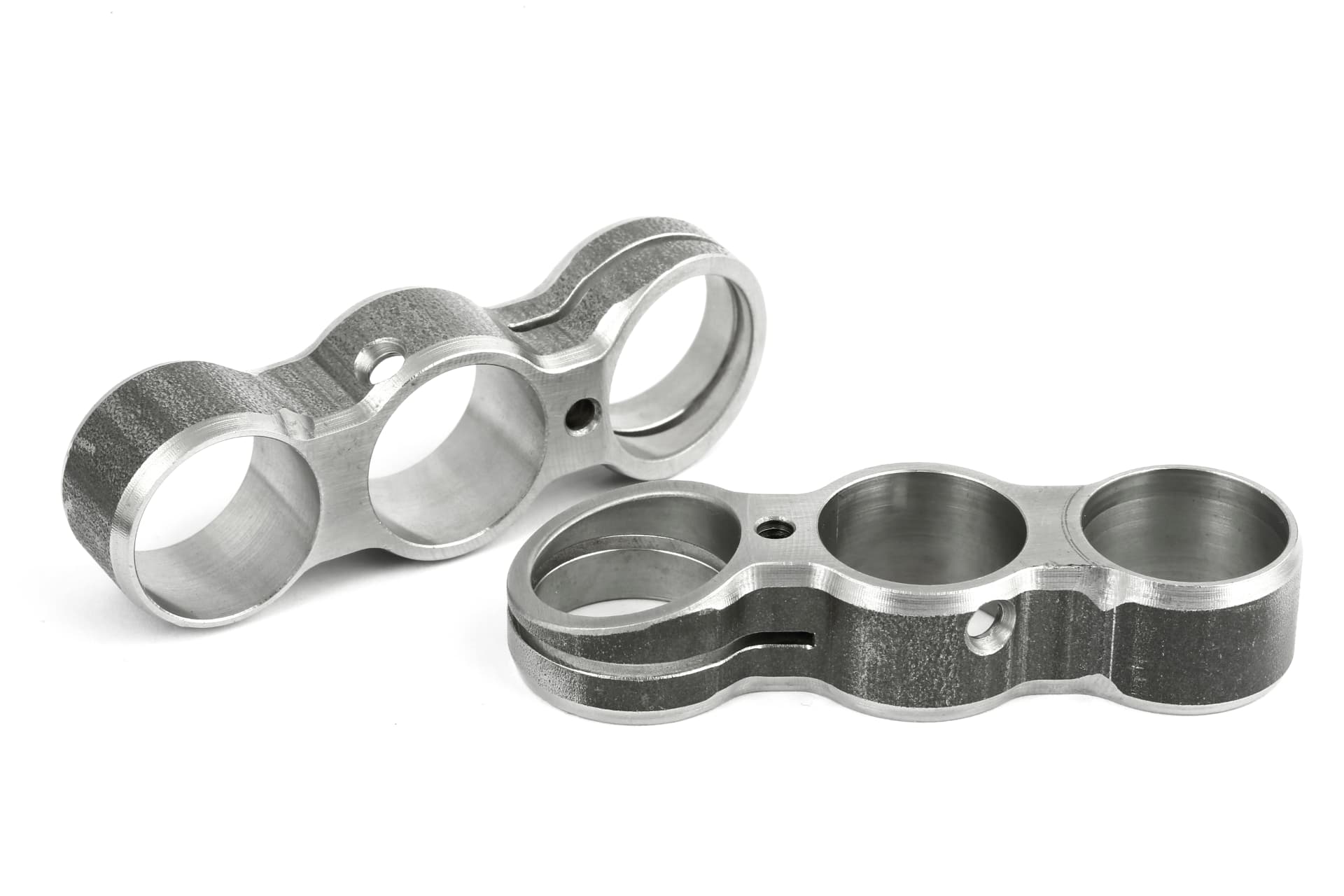Machined steel bracket components with bored housings produced by HEPTEKNIK