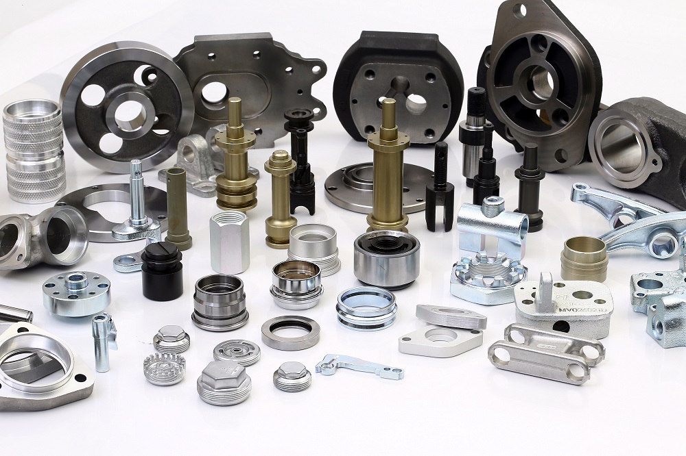 Wide range of HEPTEKNIK precision machined metal components on white background